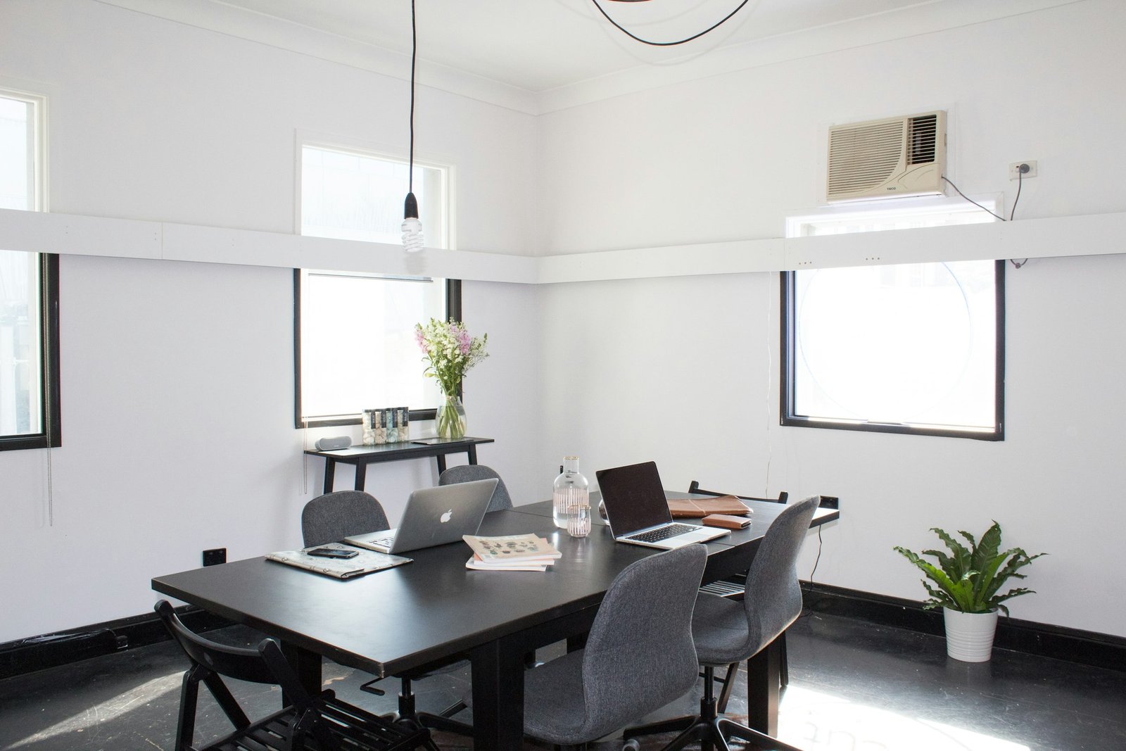 Bright studio workspace with a wooden table